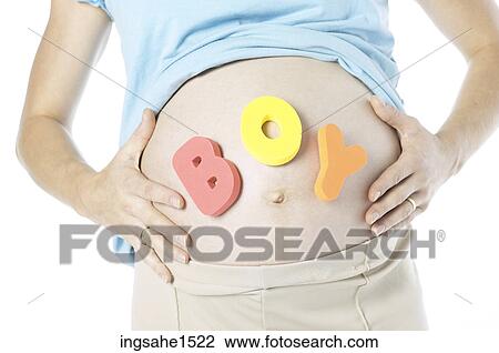 Pregnant woman with ""boy"" spelled out on stomach View Large Photo Image Stock Image - Pregnant woman with ""boy"" spelled out on stomach. Fotosearch