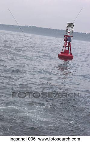 Red metal buoy off misty coast View Large Photo Image Stock Photograph - Red metal buoy off misty coast . Fotosearch
