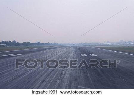 Stock Image - Runway and fog. Fotosearch