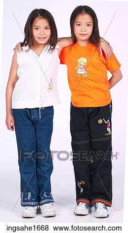 sister giving hug BE View Large Photo Image Stock Photo - sister giving hug BE. Fotosearch