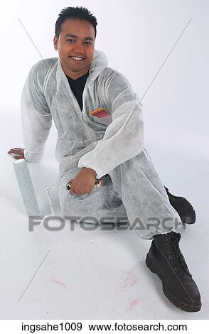 Smiling painter holding roller a81 View Large Photo Image Stock Photo - Smiling painter holding roller a81. Fotosearch