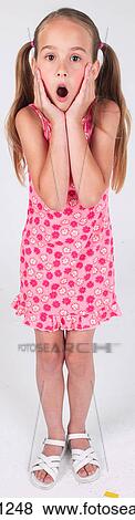 Surprised little girl View Large Photo Image Stock Photo - Surprised little girl . Fotosearch