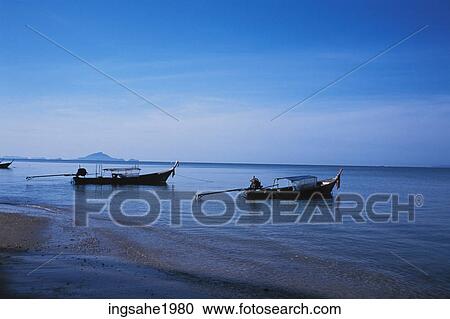 Stock Image - Two boats on the beach. Fotosearch