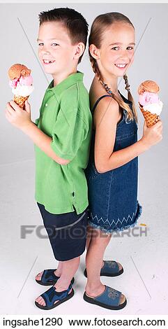 Stock Image - Two children eating ice cream . Fotosearch