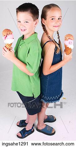 Stock Image - Two children eating ice cream . Fotosearch