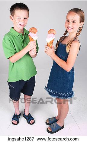 Stock Photo - Two children eating ice cream . Fotosearch