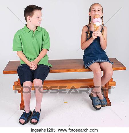 Two children eating ice cream View Large Photo Image Stock Photography - Two children eating ice cream . Fotosearch