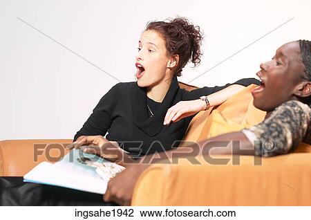 Stock Image - Two friends relaxing BE 13. Fotosearch