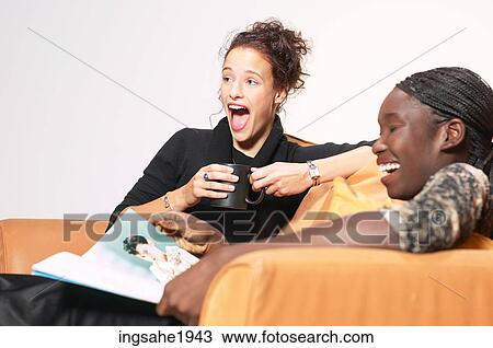 Stock Image - Two friends relaxing BE 14. Fotosearch