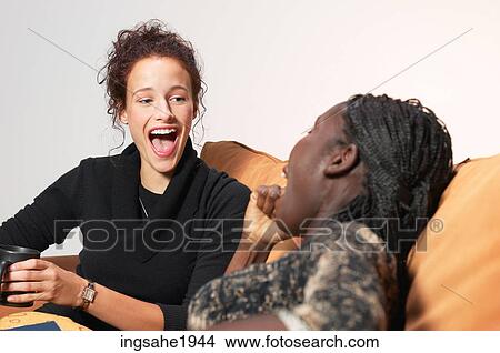Two friends relaxing BE 21 View Large Photo Image Picture - Two friends relaxing BE 21. Fotosearch
