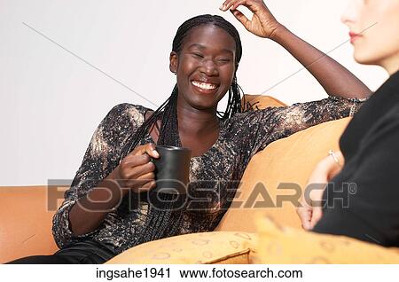 Stock Image - Two friends relaxing BE 9. Fotosearch