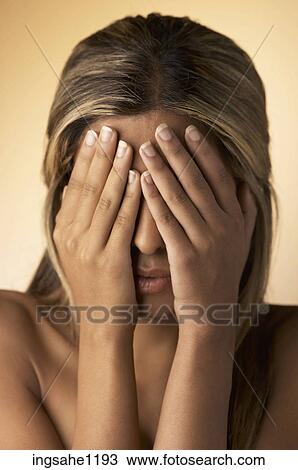 Woman covering her eyes View Large Photo Image Stock Image - Woman covering her eyes . Fotosearch