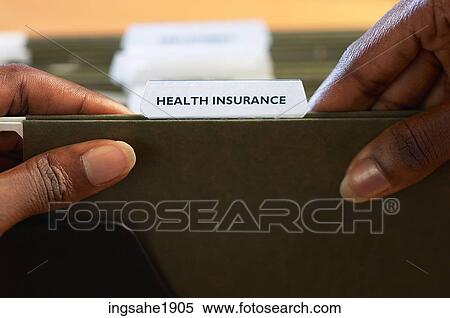 Woman holding health insurance folder BE View Large Photo Image Stock Photography - Woman holding health insurance folder BE. Fotosearch