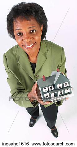 woman holding house BE View Large Photo Image Stock Photograph - woman holding house BE. Fotosearch