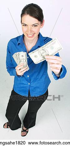 woman holding money BE 7 View Large Photo Image Stock Image - woman holding money BE 7. Fotosearch