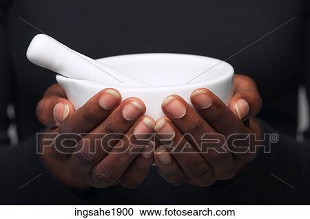 Woman holding mortar and pestle BE 4 View Large Photo Image Stock Image - Woman holding mortar and pestle BE 4. Fotosearch