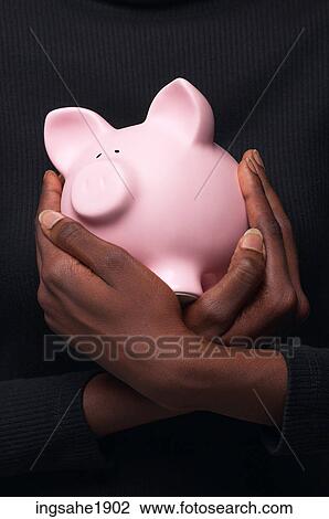 Woman holding piggy bank BE 5 View Large Photo Image Stock Image - Woman holding piggy bank BE 5. Fotosearch