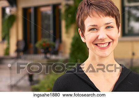 Woman in front of house BE 5 View Large Photo Image Stock Image - Woman in front of house BE 5. Fotosearch