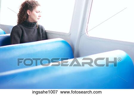 Woman looking out bus window View Large Photo Image Stock Photo - Woman looking out bus window. Fotosearch