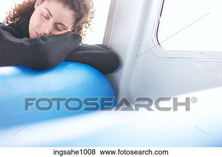 Woman napping in bus View Large Photo Image Stock Photo - Woman napping in bus. Fotosearch