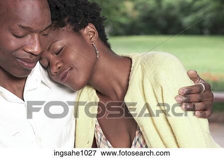 Stock Photo - Woman resting her head on man's shoulder 1. Fotosearch