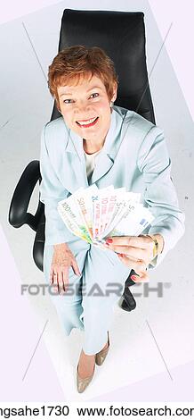 Woman Sitting in Chair BE 15 View Large Photo Image Stock Image - Woman Sitting in Chair BE 15. Fotosearch