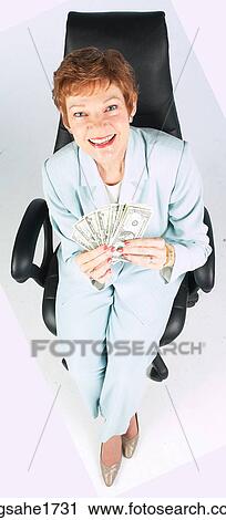 Stock Image - Woman Sitting in Chair BE 16. Fotosearch