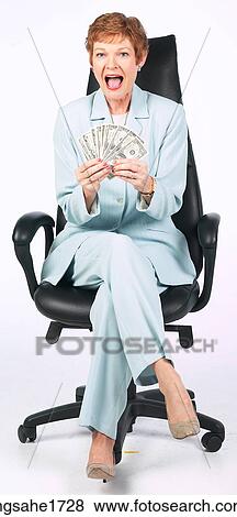 Woman Sitting in Chair BE 8 View Large Photo Image Stock Photo - Woman Sitting in Chair BE 8. Fotosearch