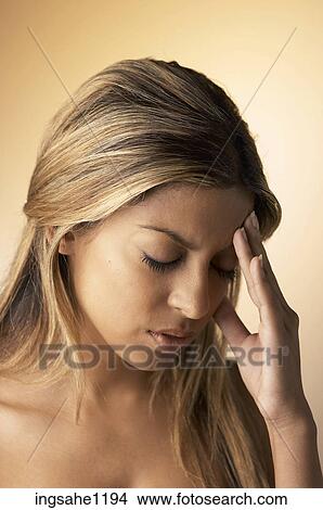 Woman with a headache View Large Photo Image Picture - Woman with a headache . Fotosearch