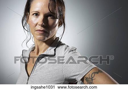 Woman with tattooed arm View Large Photo Image Stock Image - Woman with tattooed arm . Fotosearch