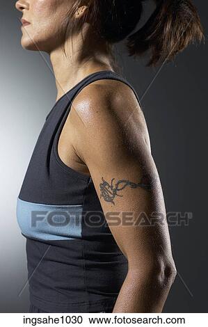 Woman's tattooed arm View Large Photo Image Stock Image - Woman's tattooed arm . Fotosearch