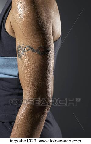 Woman's tattooed arm View Large Photo Image Stock Photo - Woman's tattooed arm. Fotosearch