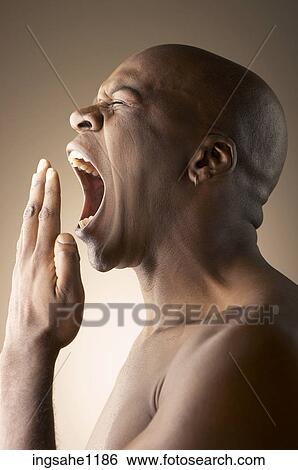 Yawning man View Large Photo Image Stock Photograph - Yawning man . Fotosearch