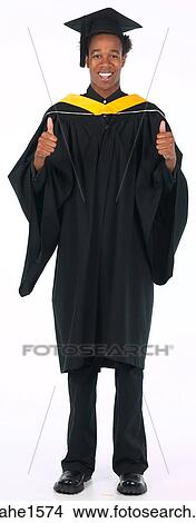 Picture - young man wearing graduation gown . Fotosearch