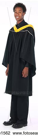Stock Image - young man wearing graduation gown . Fotosearch