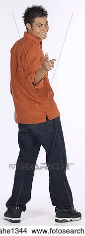 young man with orange shirt View Large Photo Image Picture - young man with orange shirt . Fotosearch