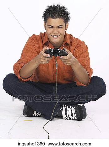 Stock Image - young man with orange shirt . Fotosearch