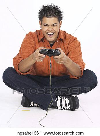 Stock Image - young man with orange shirt . Fotosearch