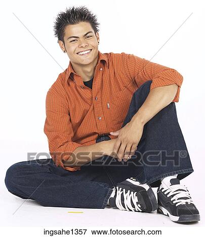 young man with orange shirt View Large Photo Image Stock Photo - young man with orange shirt . Fotosearch