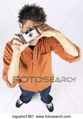 young man with orange shirt View Large Photo Image Stock Photo - young man with orange shirt . Fotosearch