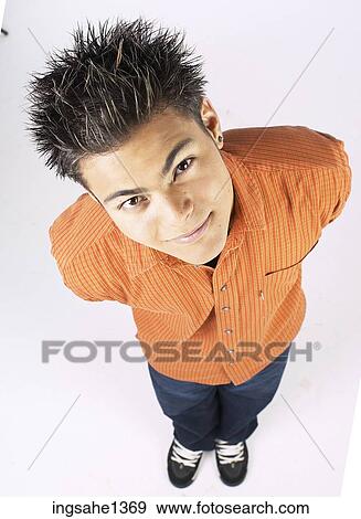 young man with orange shirt View Large Photo Image Stock Photo - young man with orange shirt . Fotosearch