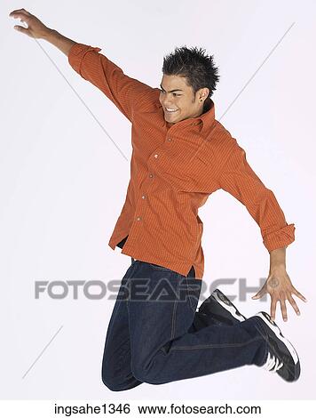 young man with orange shirt View Large Photo Image Stock Photograph - young man with orange shirt . Fotosearch