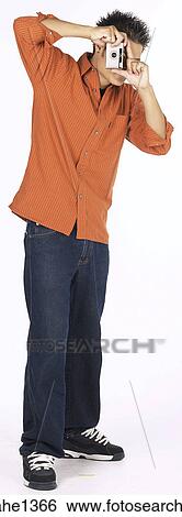 Stock Photograph - young man with orange shirt . Fotosearch