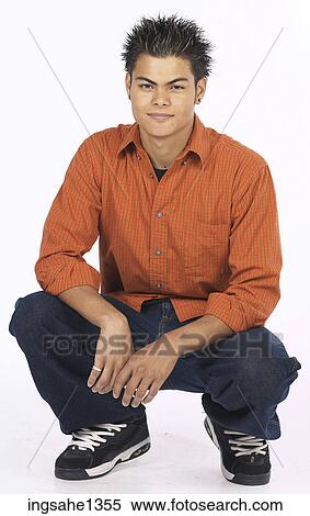 Stock Photography - young man with orange shirt . Fotosearch