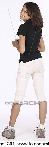 Stock Image - young woman in black shirt . Fotosearch
