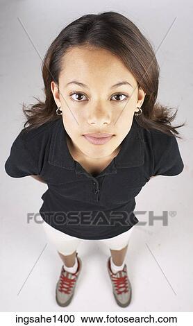 Stock Image - young woman in black shirt . Fotosearch