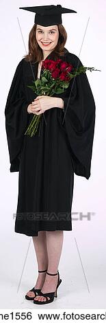 Stock Photograph - young woman wearing graduation gown . Fotosearch