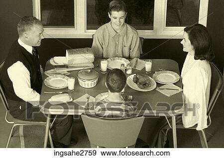 1950s family at dinner praying View Large Photo Image Stock Photo - 1950s family at dinner praying . Fotosearch