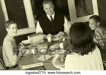 1950s family at dinner table View Large Photo Image Picture - 1950s family at dinner table . Fotosearch