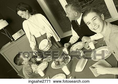 1950s family at dinner table View Large Photo Image Stock Image - 1950s family at dinner table . Fotosearch